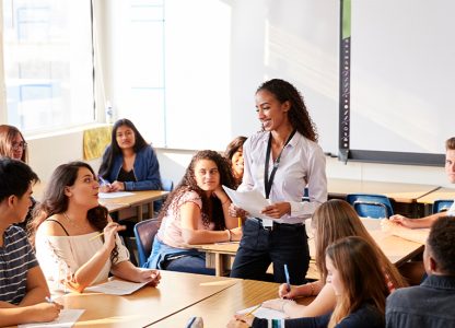 Teacher and students in a classroom setting